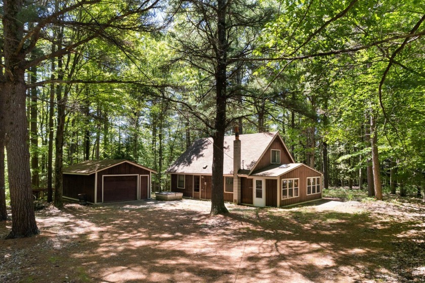 Cabin in the woods in Filer Township! 2 acres of towering - Beach Home for sale in Manistee, Michigan on Beachhouse.com