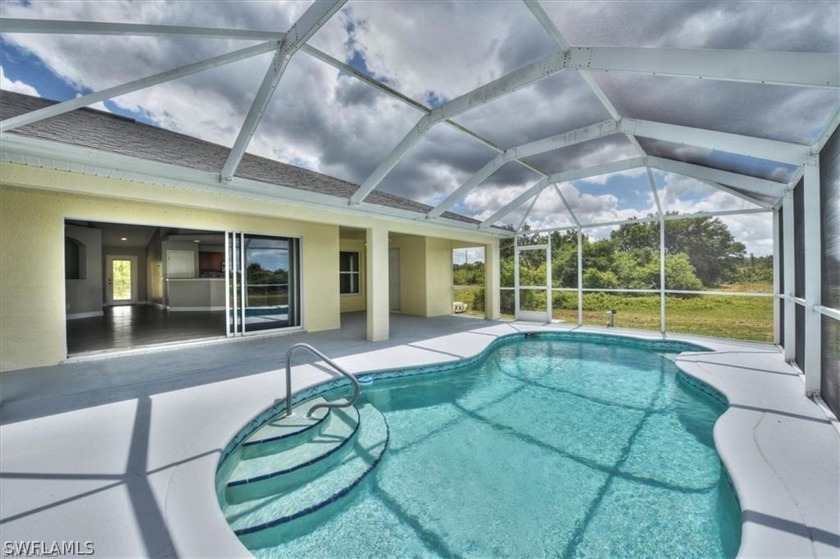 This luxury pool home offers 3br plus a den/office along with a - Beach Home for sale in Lehigh Acres, Florida on Beachhouse.com