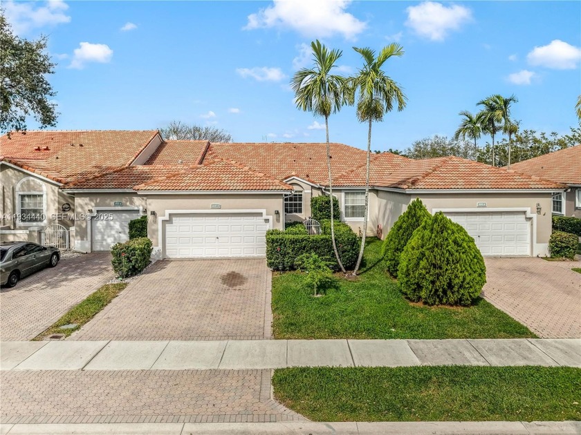 Welcome to this one-level, fee-simple waterfront villa located - Beach Home for sale in Sunrise, Florida on Beachhouse.com