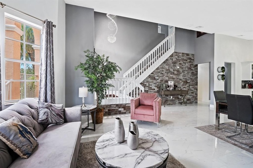 WARM & INVITING WATERFRONT HOME  IN THE DESIRABLE GATED - Beach Home for sale in Pembroke Pines, Florida on Beachhouse.com