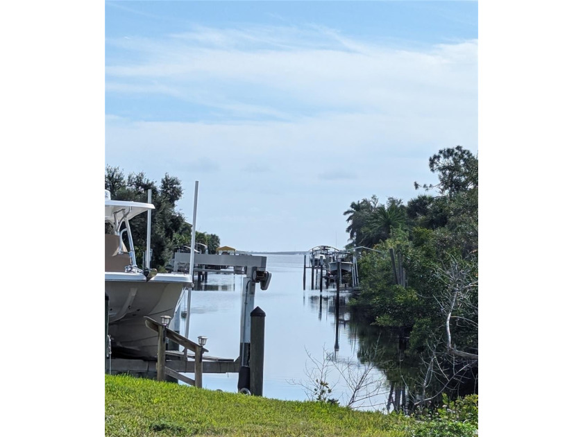 Nestled along the serene banks of a picturesque canal, this - Beach Lot for sale in Port Charlotte, Florida on Beachhouse.com