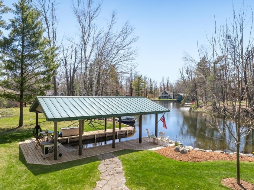 Located on the Crooked River close to Burt Lake.  This - Beach Home for sale in Brutus, Michigan on Beachhouse.com