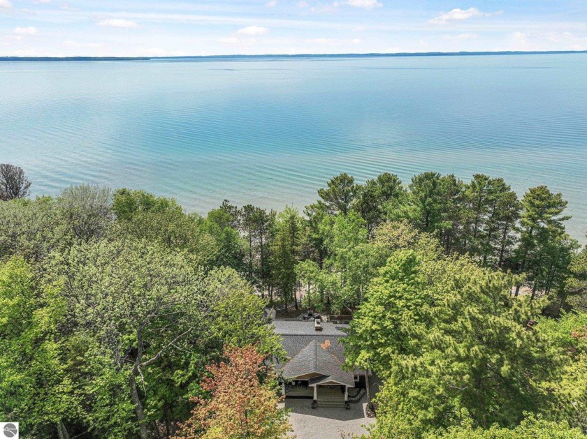 Welcome to your dream home on the sparkling shores of Grand - Beach Home for sale in Kewadin, Michigan on Beachhouse.com