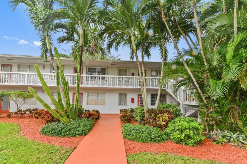 Discover exceptional lakeside living in this rare, rentable - Beach Condo for sale in Deerfield Beach, Florida on Beachhouse.com