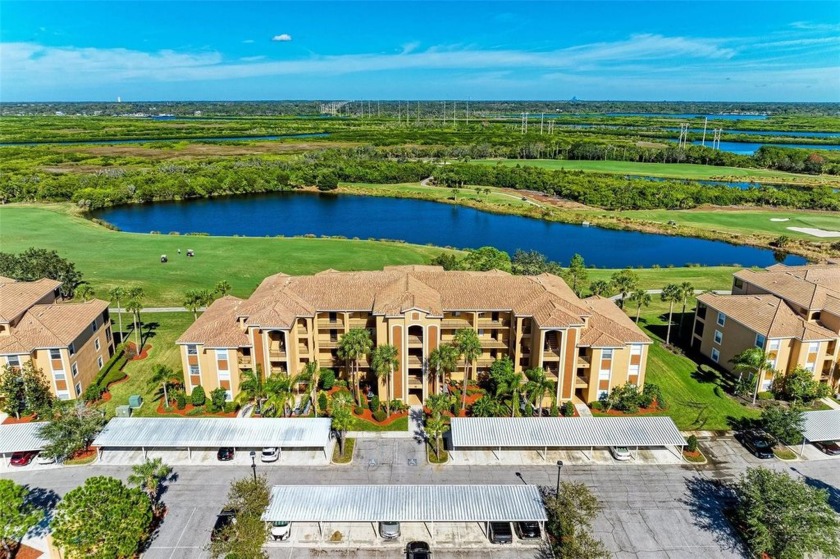 Stunning GOLF and WATER views await you in this TOP-FLOOR - Beach Condo for sale in Bradenton, Florida on Beachhouse.com