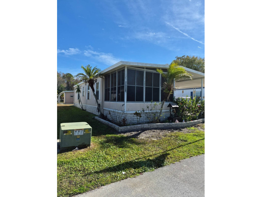THIS DOUBLE WIDE HAS 2 BEDROOMS AND 2 BATHS, LOCATED IN HACIENDA - Beach Home for sale in New Port Richey, Florida on Beachhouse.com