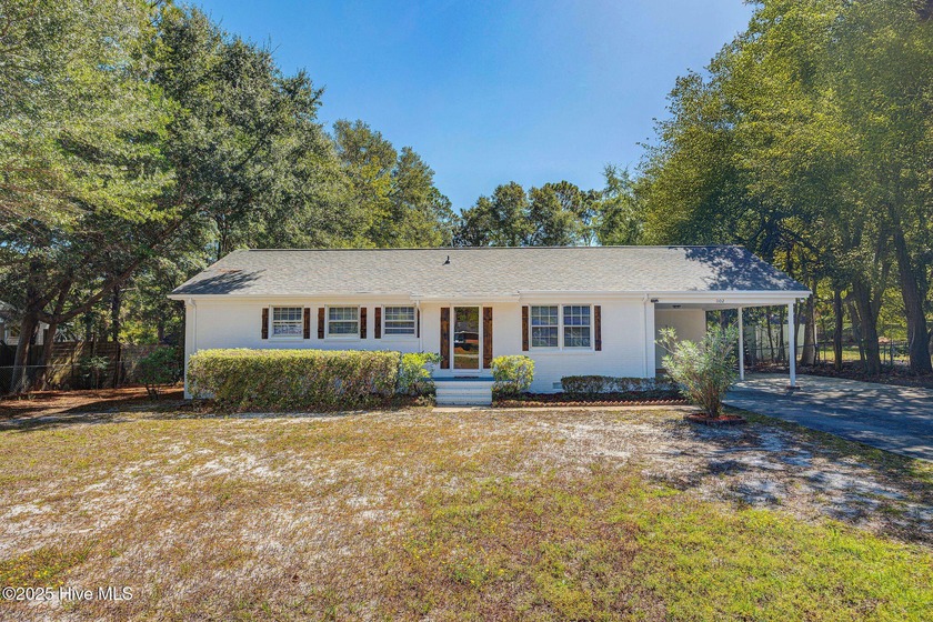 Thoughtfully renovated and move-in ready, this 4-bedroom, 3-bath - Beach Home for sale in Wilmington, North Carolina on Beachhouse.com