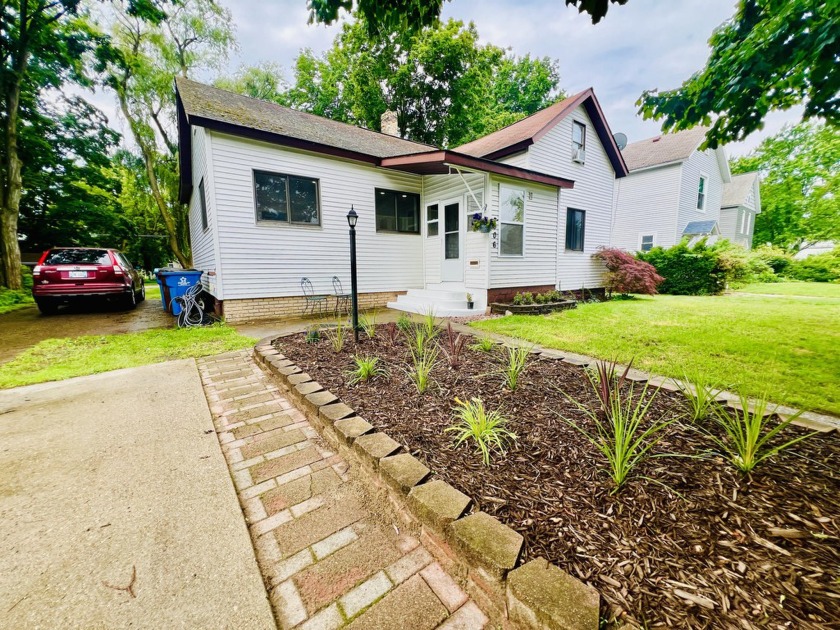 Updates, updates, updates! This city of Ludington home features - Beach Home for sale in Ludington, Michigan on Beachhouse.com