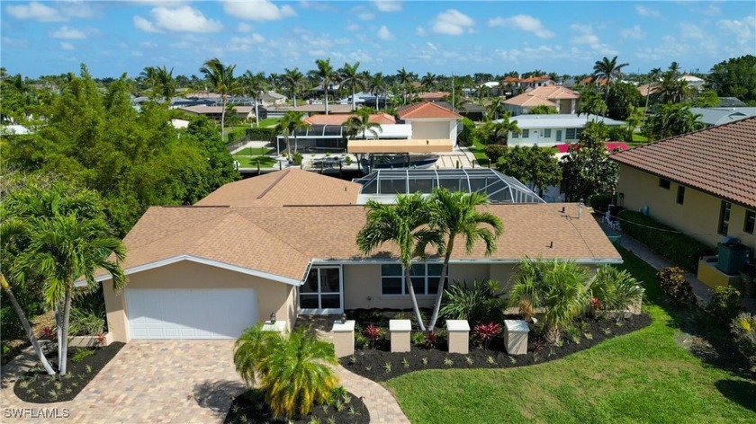 THIS BEAUTIFULLY RENOVATED FLORIDA-STYLE HOME strikes the - Beach Home for sale in Cape Coral, Florida on Beachhouse.com