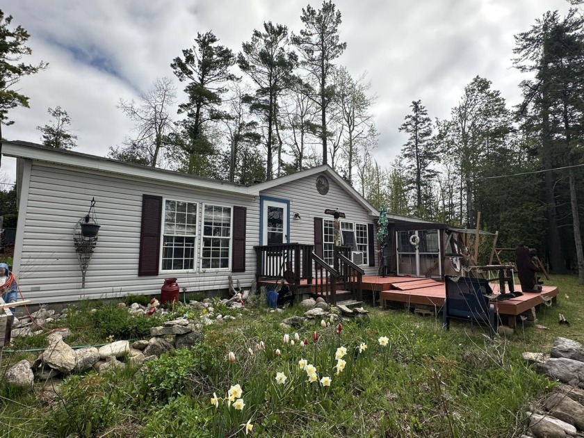 Enjoy waterfront living with 180 feet of frontage on the Thunder - Beach Home for sale in Alpena, Michigan on Beachhouse.com
