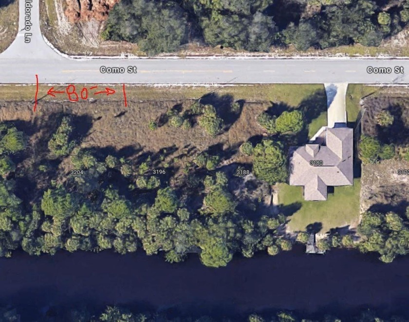 Nestled along the serene banks of a picturesque canal, this - Beach Lot for sale in Port Charlotte, Florida on Beachhouse.com