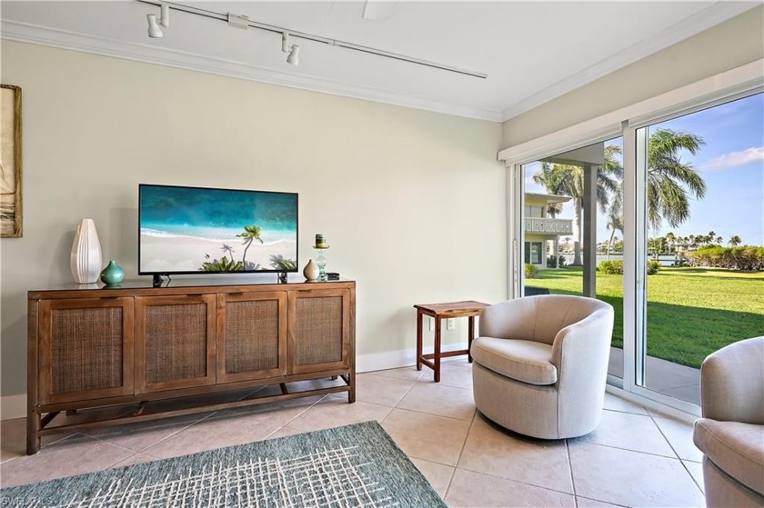 Watch boats & dolphins thru the BRAND NEW IMPACT RESISTANT GLASS - Beach Condo for sale in Marco Island, Florida on Beachhouse.com