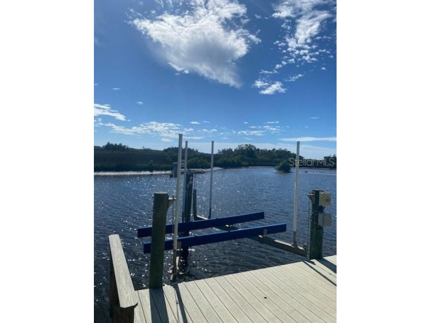 A private DOCK & BOAT LIFT compliment this beautiful WATERFRONT - Beach Condo for sale in Crystal River, Florida on Beachhouse.com