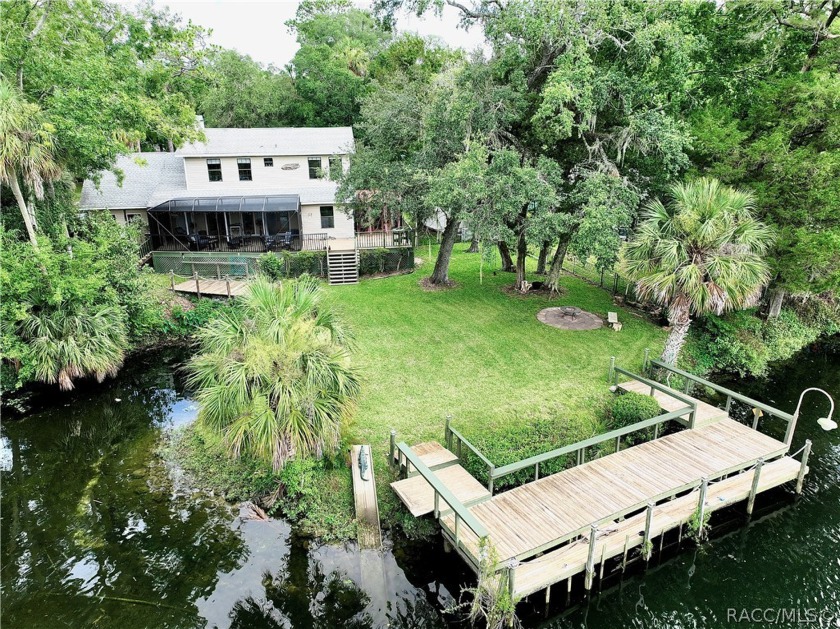 Tucked away amidst 1 acre (mol) of lush greenery, this - Beach Home for sale in Yankeetown, Florida on Beachhouse.com