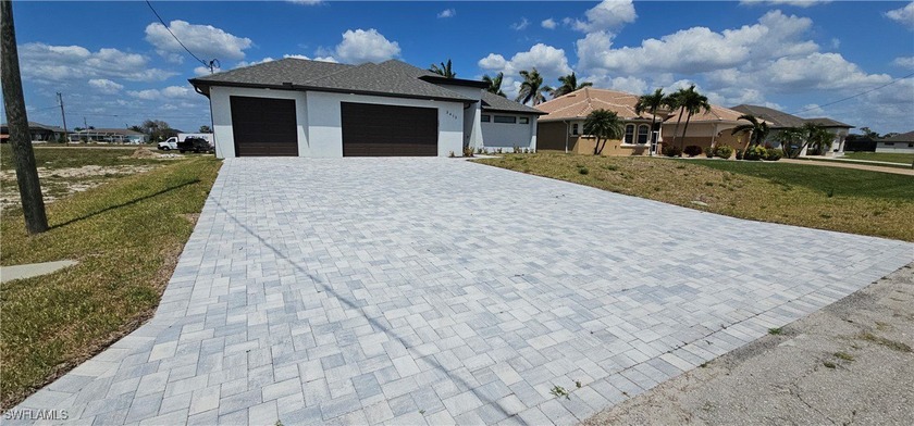 Welcome to this breathtaking new construction pool home in the - Beach Home for sale in Cape Coral, Florida on Beachhouse.com