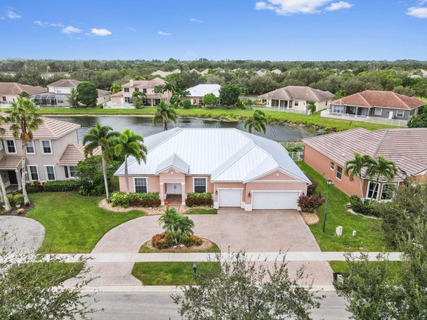 Discover this beautiful lakefront home set in a peaceful, gated - Beach Home for sale in Lake Worth, Florida on Beachhouse.com