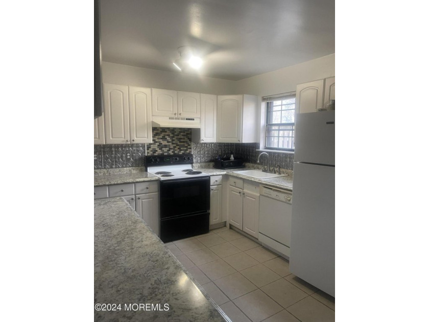 Step into this inviting 2-bedroom, 2-bathroom townhome that - Beach Condo for sale in Brick, New Jersey on Beachhouse.com