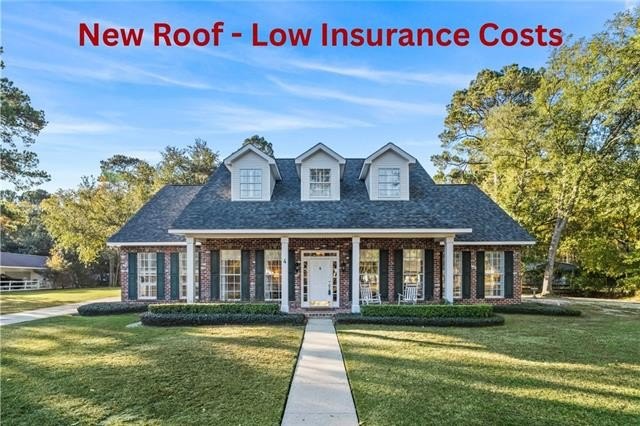 This stunning 4-bedroom, 3.5-bath home is tucked away on a 1 - Beach Home for sale in Mandeville, Louisiana on Beachhouse.com