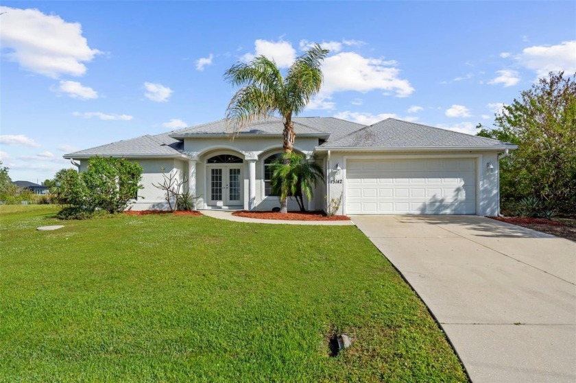 This is a beautiful three-bedroom, two-bath pool home positioned - Beach Home for sale in Port Charlotte, Florida on Beachhouse.com