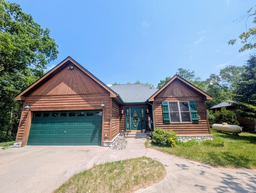 Beautiful custom built 4 bedroom 3 bath home within walking - Beach Home for sale in Oscoda, Michigan on Beachhouse.com
