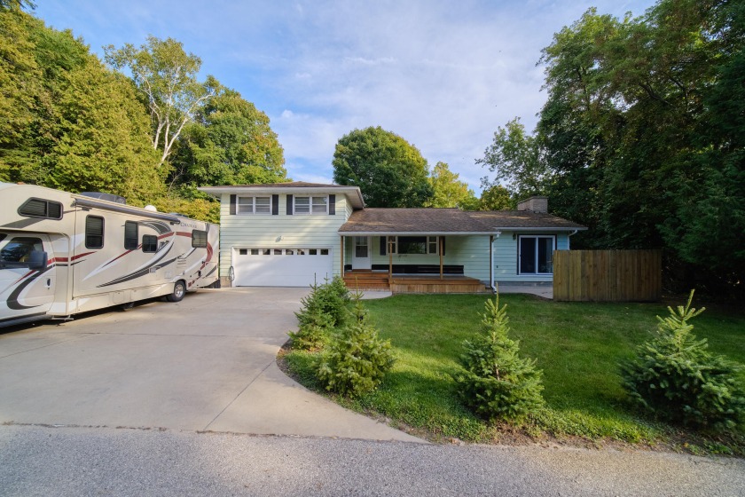 Deeded PORTAGE LAKE waterfront comes with this 3 bedroom, 1.5 - Beach Home for sale in Onekama, Michigan on Beachhouse.com