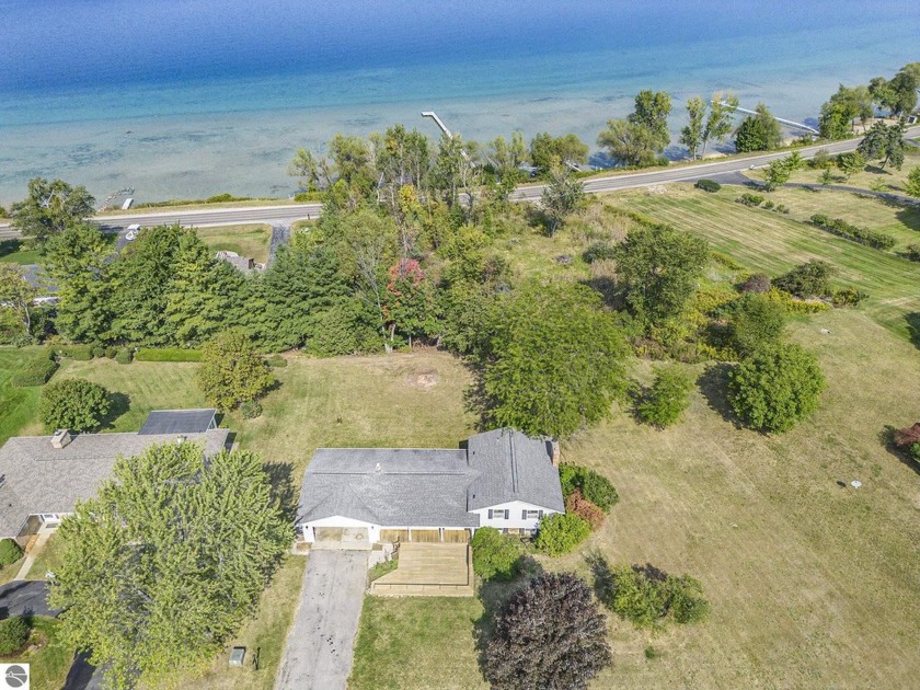 100' PRIVATE FRONTAGE! Retro Waterfront Gem. Discover Your Own - Beach Home for sale in Traverse City, Michigan on Beachhouse.com