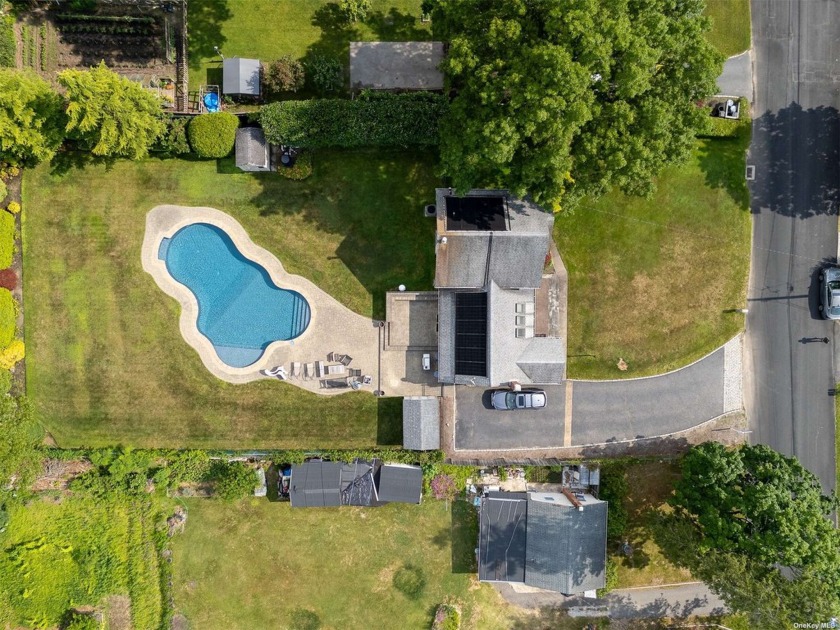 Step up on the wide paving stone steps and wide front patio and - Beach Home for sale in Shirley, New York on Beachhouse.com