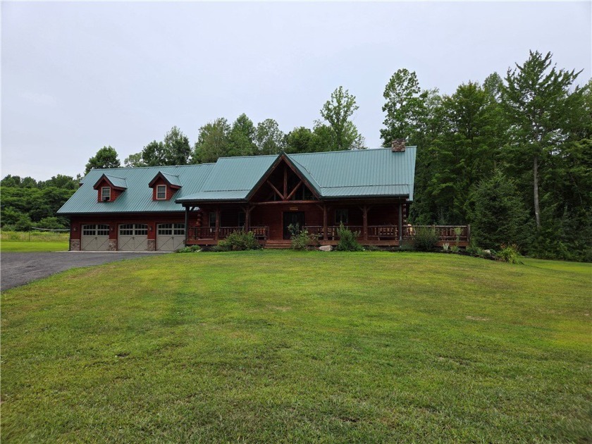 This beautiful three-bedroom, four-bath log home provides plenty - Beach Home for sale in North Rose, New York on Beachhouse.com