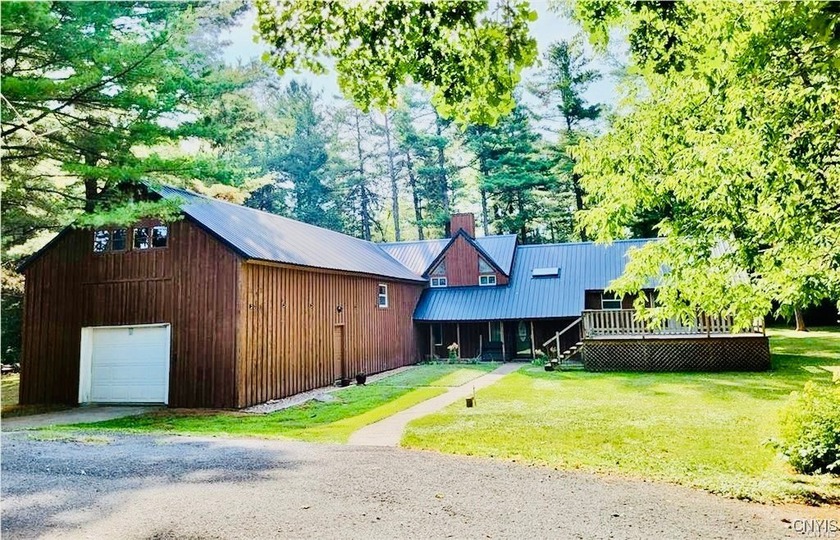 Nestled in the woods with an abundance of privacy, this - Beach Home for sale in Chaumont, New York on Beachhouse.com