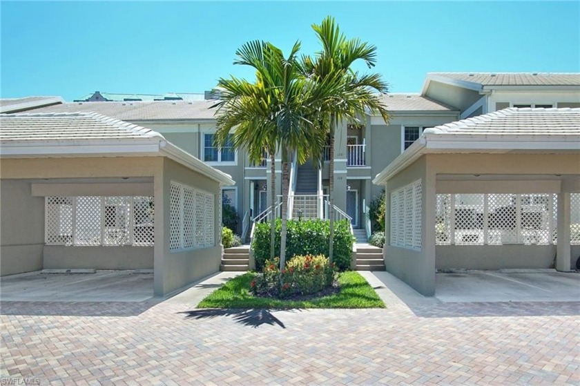 Lovely updated second floor unit enjoys lake and lush landscape - Beach Home for sale in Naples, Florida on Beachhouse.com