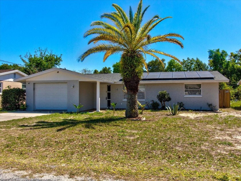 Check out this Holiday Pool Home on oversized lot with a very - Beach Home for sale in Holiday, Florida on Beachhouse.com