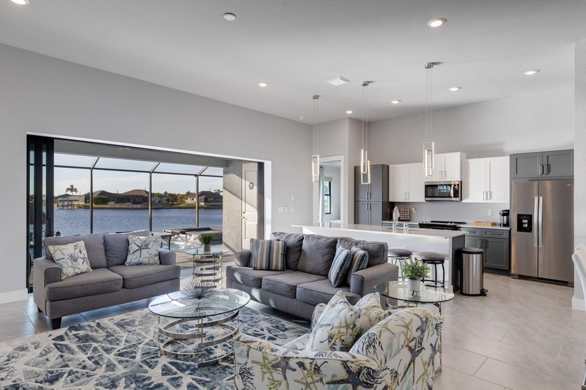 Stunning 2024-built lakefront 5BR/4 BA home with 2 primary - Beach Home for sale in Cape Coral, Florida on Beachhouse.com