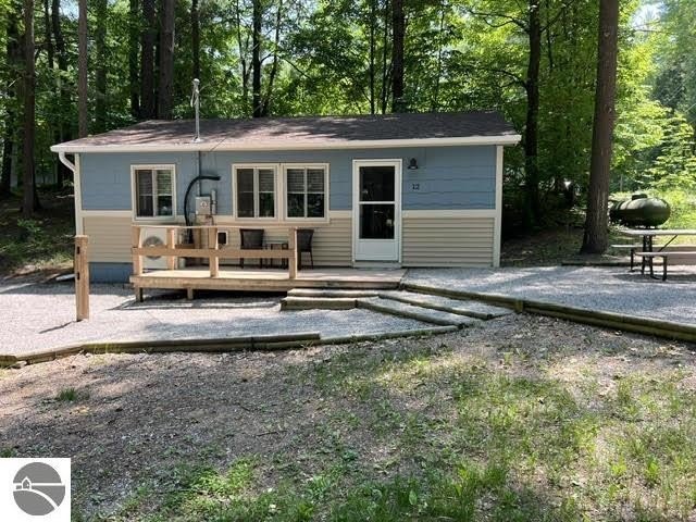 Charming Modern Lake Cottage at Pineview Resort - Arbutus Lake - Beach Home for sale in Traverse City, Michigan on Beachhouse.com