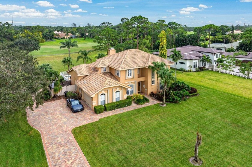 Spacious 5-bedroom, 4-bath, two-story home on a 1-acre lot in - Beach Home for sale in West Palm Beach, Florida on Beachhouse.com