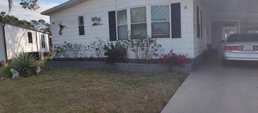 WELCOME TO YOUR NEW LOVELY HOME IN LAKE FAIRWAYS COUNTRY CLUB - Beach Home for sale in North Fort Myers, Florida on Beachhouse.com