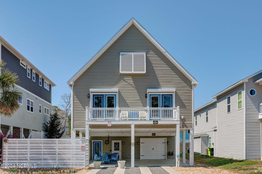 This single-family custom-built residence boasts 5 bedrooms and - Beach Home for sale in Carolina Beach, North Carolina on Beachhouse.com