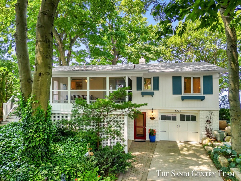 This charming home, nestled on the picturesque shores of Lake - Beach Home for sale in Holland, Michigan on Beachhouse.com