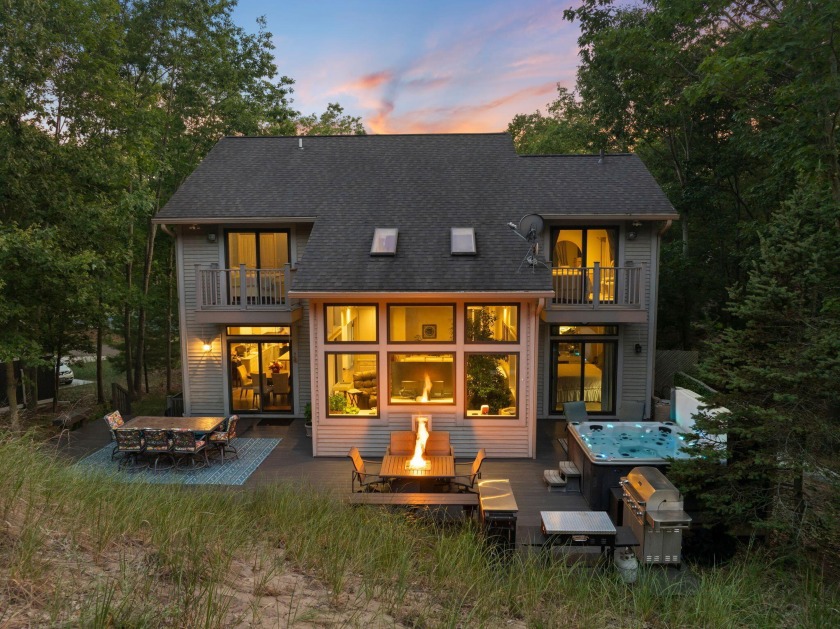 Embrace Lakeside Living! Nestled on a triple city lot in the - Beach Home for sale in Spring Lake, Michigan on Beachhouse.com