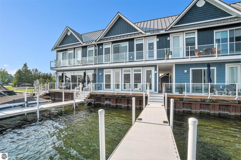 Welcome to the most refined offering in Boathouse Village, fully - Beach Condo for sale in Alanson, Michigan on Beachhouse.com