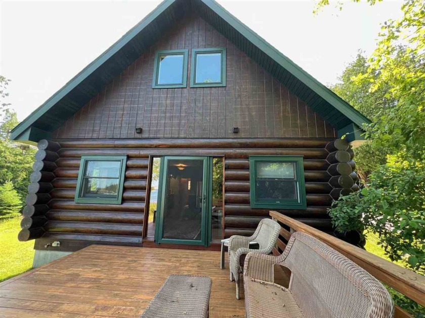 Nestled in a magical location, this charming log home offers a - Beach Home for sale in DE Tour Village, Michigan on Beachhouse.com