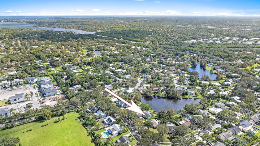 This lakefront home in Jupiter Landings boasts a fully renovated - Beach Home for sale in Jupiter, Florida on Beachhouse.com