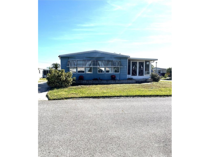 Very nice home on a corner lot with a peek-a-boo view of Lake - Beach Home for sale in North Port, Florida on Beachhouse.com