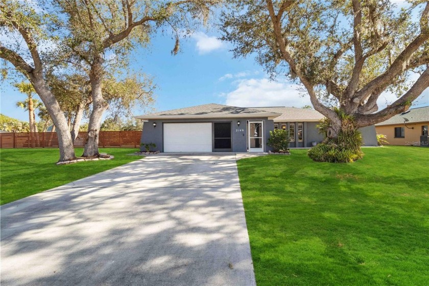 Nestled along serene waterfront views with Gulf access, this - Beach Home for sale in Port Charlotte, Florida on Beachhouse.com