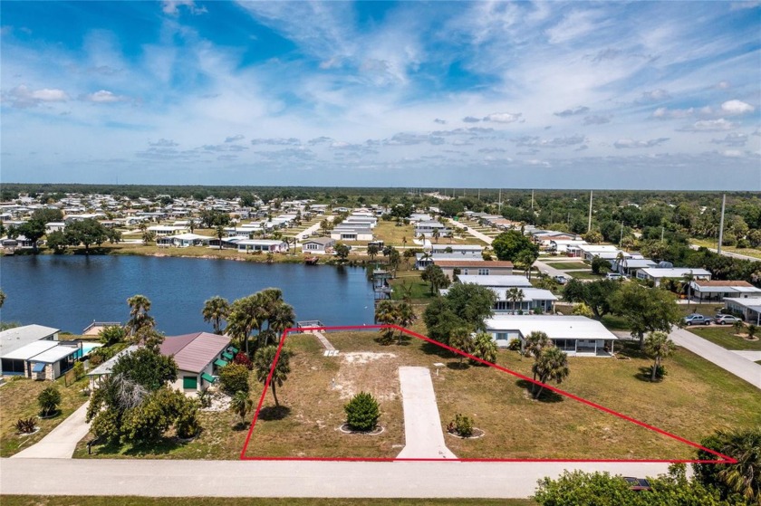 Now is the time to invest in this prime lakeside lot with a dock - Beach Lot for sale in Englewood, Florida on Beachhouse.com