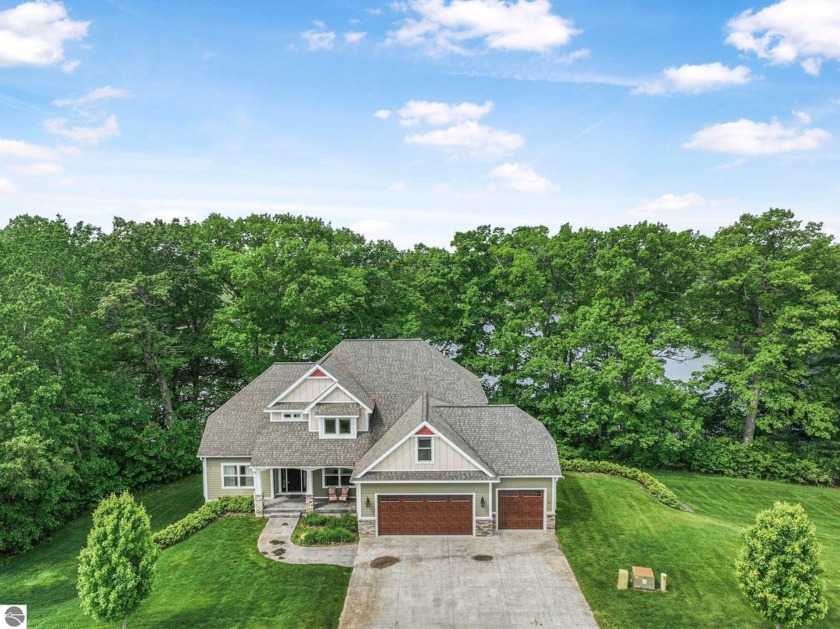 Experience luxury lakefront living in this stunning 5-bedroom, 4 - Beach Home for sale in Traverse City, Michigan on Beachhouse.com