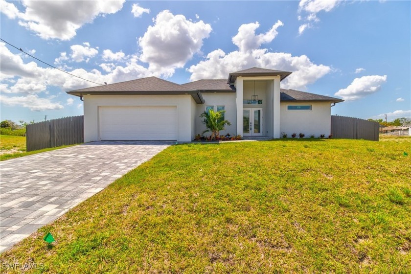 NEW CONSTRUCTION...Step into modern elegance with this - Beach Home for sale in Cape Coral, Florida on Beachhouse.com