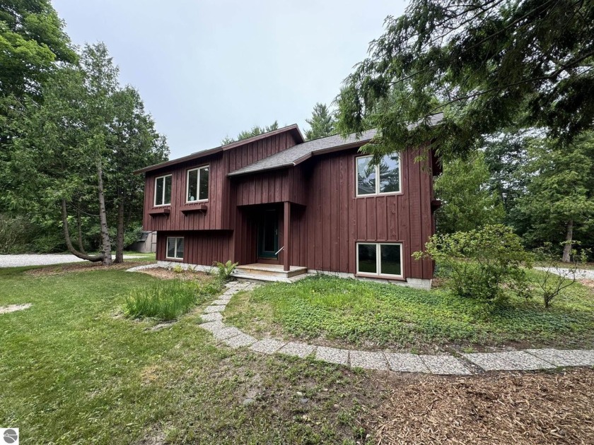 Nestled in the sought-after Leland Village, this inviting - Beach Home for sale in Leland, Michigan on Beachhouse.com