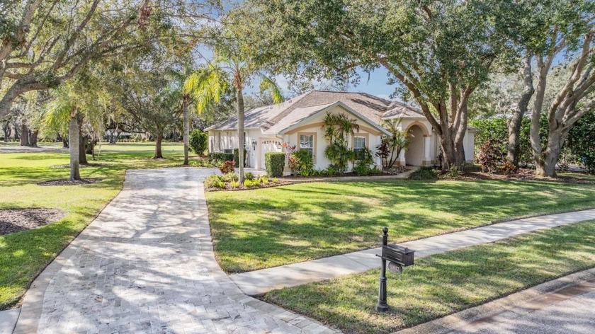 Style and sophistication abound in this Updated Pool Home - Beach Home for sale in Tarpon Springs, Florida on Beachhouse.com