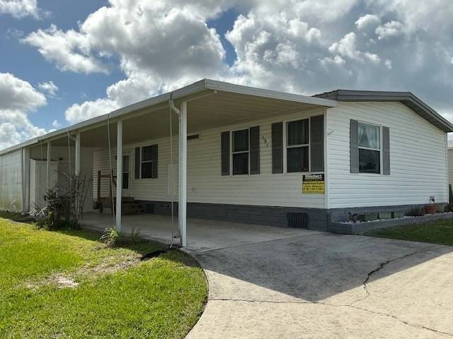 Enjoy peaceful lakefront living in this well-maintained modular - Beach Lot for sale in Melbourne, Florida on Beachhouse.com