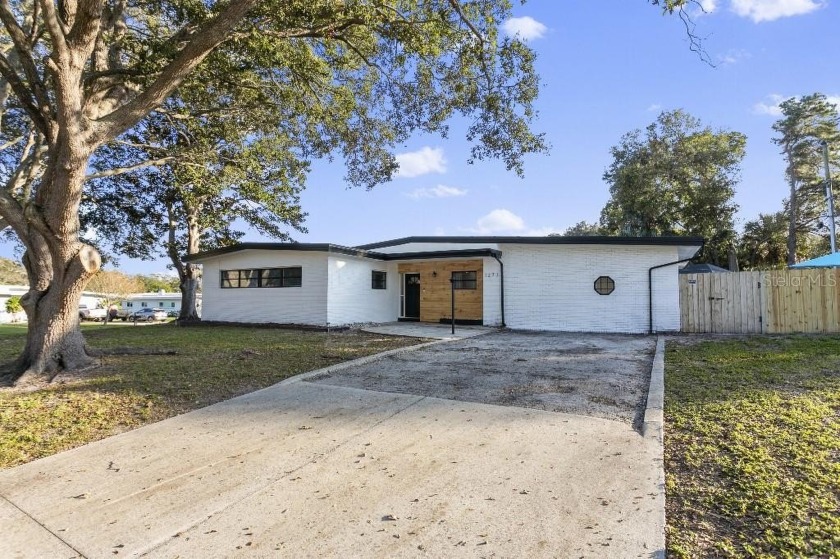 Nestled in a peaceful, non-flood zone neighborhood, this - Beach Home for sale in Clearwater, Florida on Beachhouse.com